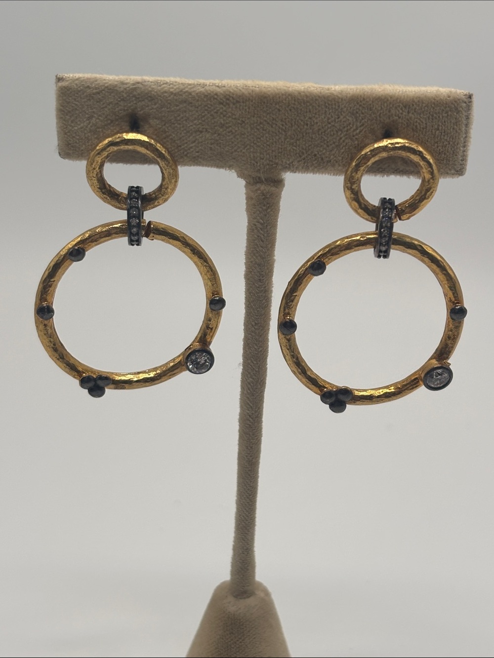 Hammered Gold Tone Circle Dangle Earrings with Crystal Accents.